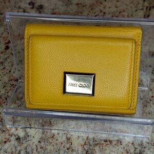 Jimmy Choo Magda compact trifold wallet in a vibrant yellow calfskin leather